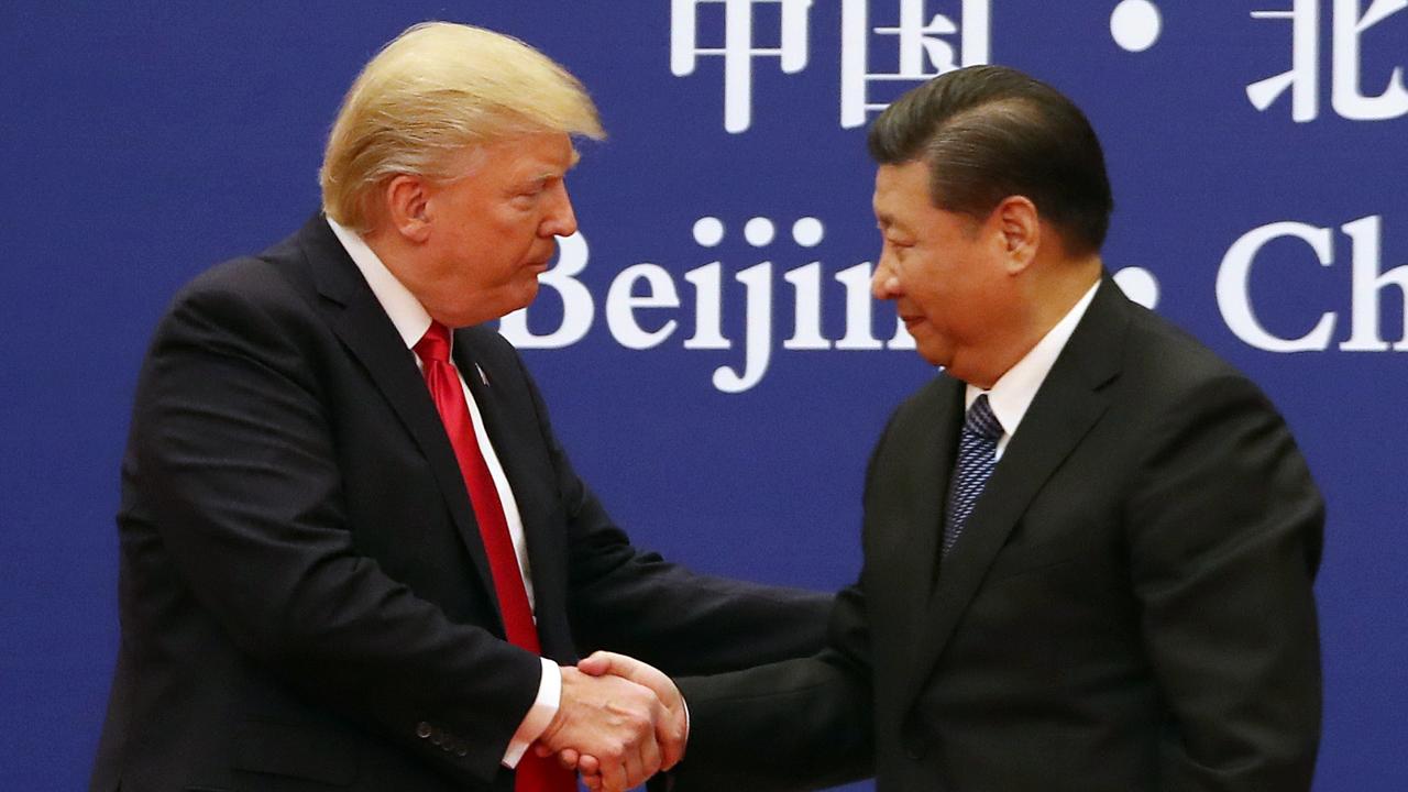 China’s Xi in the limelight at Pacific summit with Trump conspicuous by his absence